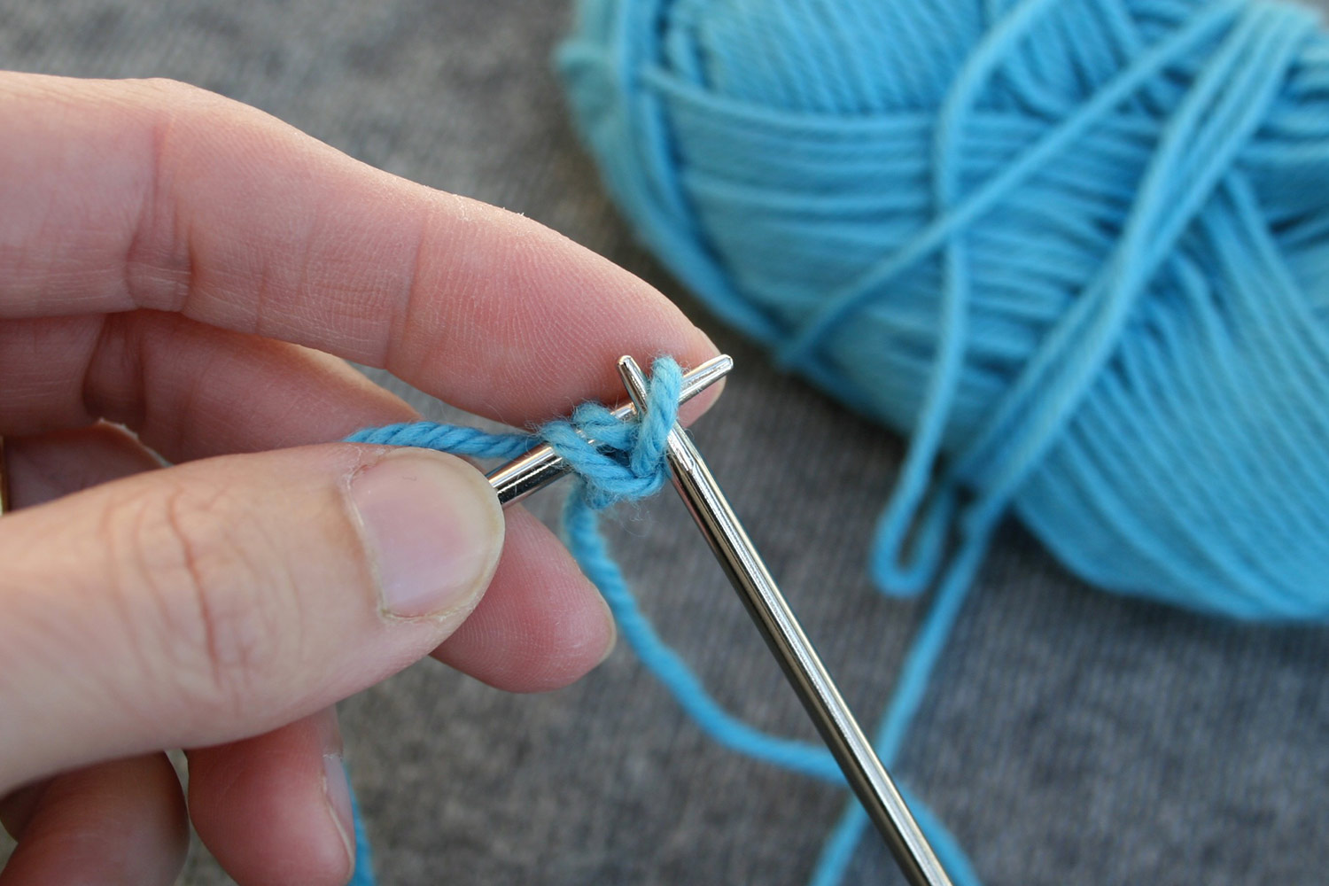 Both right and left needle inserted in same stitch as it's being transferred from right to left needle.