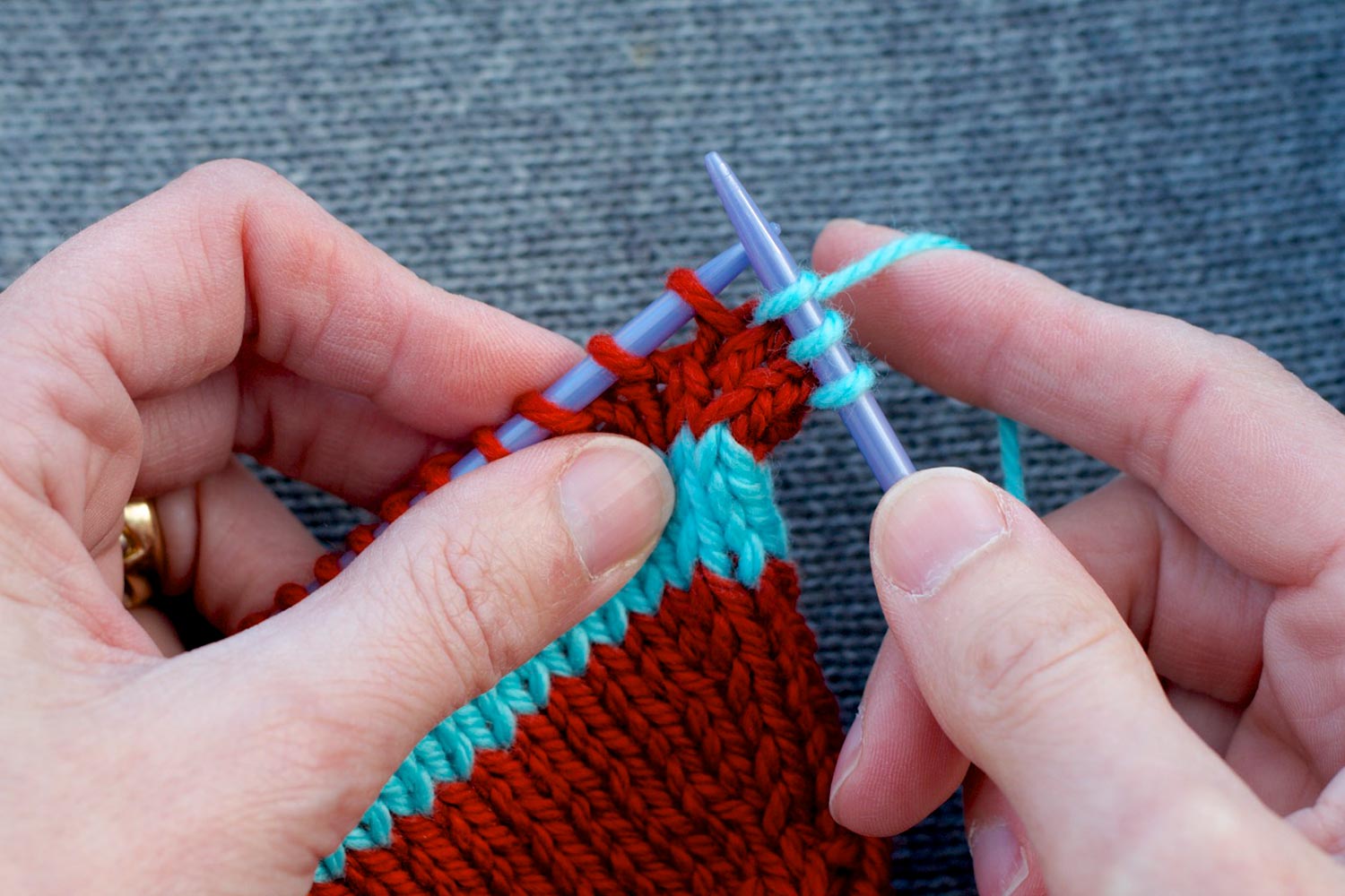 Right-slanting raised increase completed with first three stitches of row on right needle and remaining stitches on left needle.