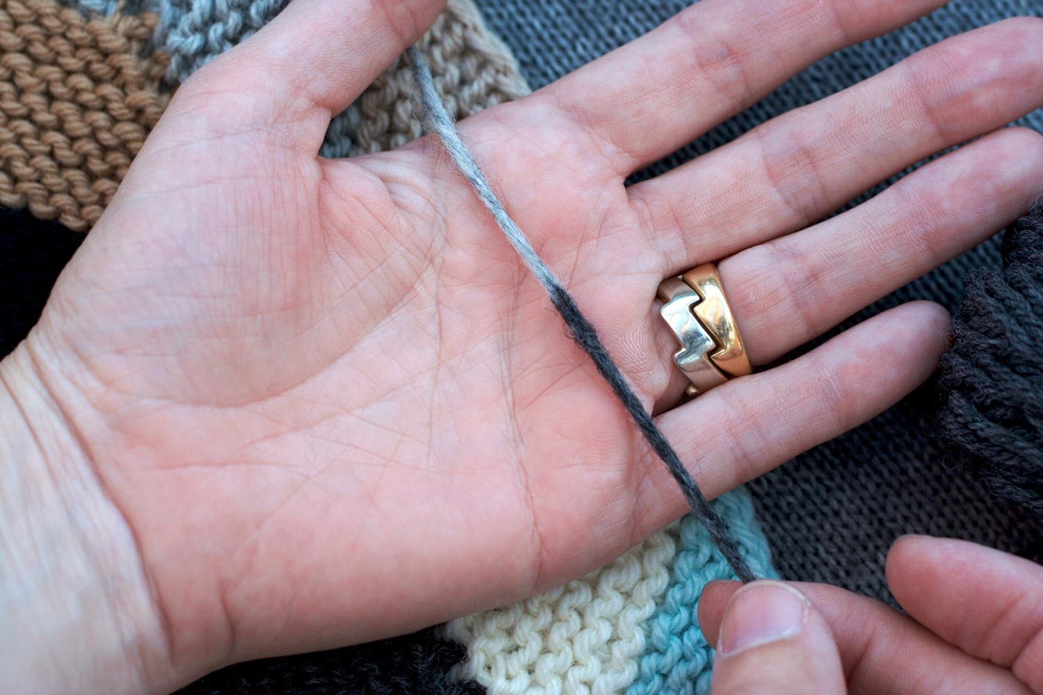Felted together two-colour join  laid across palm of hand looking even and consistent along its length.