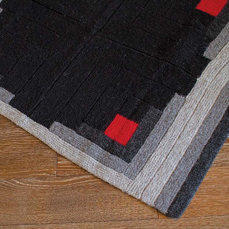 Log cabin style blanket using modular knitting techniques.