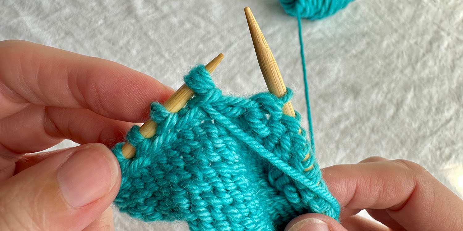 With wrong side facing, triplet stitch is on left needle; triplet stitch is completed.