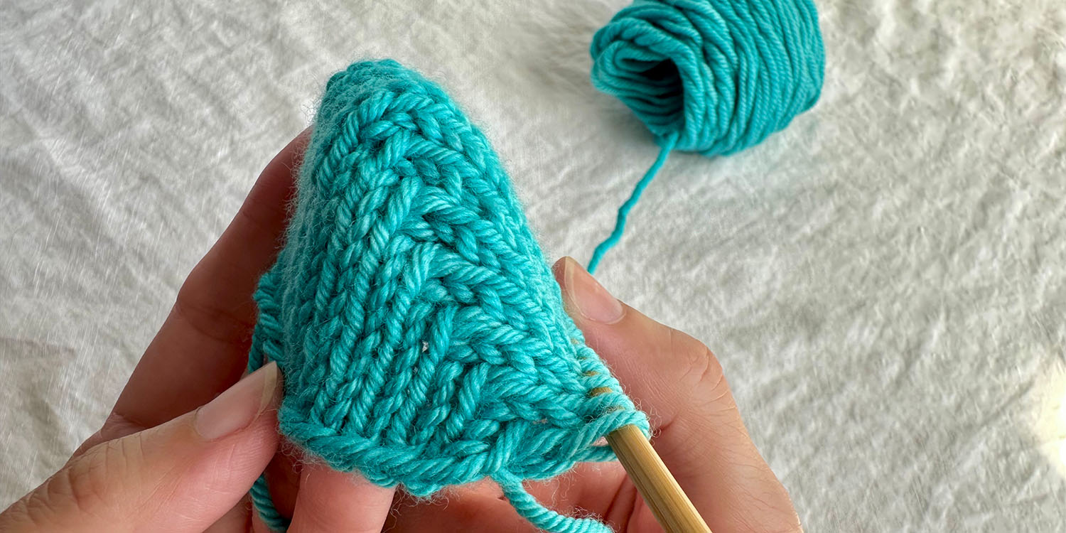 Toe sample in worsted weight yarn showing completed short row shaping.