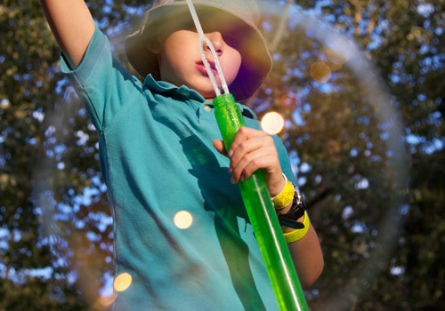 blowing bubbles in the park